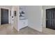 Bright entryway with built-in shelving and tile flooring at 17403 W Eagle Ct, Goodyear, AZ 85338