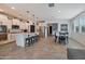 Modern kitchen with white cabinets, island, and stainless steel appliances at 17403 W Eagle Ct, Goodyear, AZ 85338