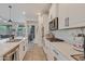 Modern kitchen with white cabinets, island, and stainless steel appliances at 17403 W Eagle Ct, Goodyear, AZ 85338
