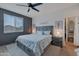 Serene main bedroom with a king-size bed and walk-in closet at 17403 W Eagle Ct, Goodyear, AZ 85338