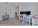 Home office with desk, chair, and additional seating at 17403 W Eagle Ct, Goodyear, AZ 85338