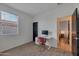 Well-lit home office with built-in desk and chair at 17403 W Eagle Ct, Goodyear, AZ 85338