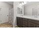 Modern bathroom with double vanity and shower at 17440 W Eugene Ter, Surprise, AZ 85388