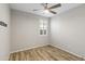 Well-lit bedroom with wood floors and window at 17440 W Eugene Ter, Surprise, AZ 85388