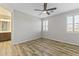Spacious bedroom with wood floors and en-suite bathroom access at 17440 W Eugene Ter, Surprise, AZ 85388