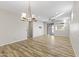 Bright dining room with wood floors, chandelier, and access to the backyard at 17440 W Eugene Ter, Surprise, AZ 85388