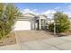 House exterior with white garage door and landscaping at 17440 W Eugene Ter, Surprise, AZ 85388
