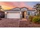 House exterior with white garage door and landscaping at 17440 W Eugene Ter, Surprise, AZ 85388