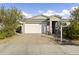 House exterior with white garage door and landscaping at 17440 W Eugene Ter, Surprise, AZ 85388