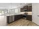 Modern kitchen with stainless steel appliances and an island at 17440 W Eugene Ter, Surprise, AZ 85388