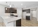 Modern kitchen with stainless steel appliances and an island at 17440 W Eugene Ter, Surprise, AZ 85388