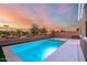 Inviting backyard pool and spa with a gorgeous sunset view at 17440 W Eugene Ter, Surprise, AZ 85388