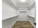 Spacious walk-in closet with double hanging rods and shelving at 17440 W Eugene Ter, Surprise, AZ 85388