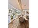 Dining room with a rustic wooden table and stylish light fixture at 17472 W Larkspur Dr, Surprise, AZ 85388