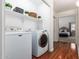 Convenient laundry room with washer, dryer, and shelving at 1762 S Saddle St, Gilbert, AZ 85233