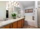 Elegant bathroom with granite countertops, double sinks, and a soaking tub at 1762 S Saddle St, Gilbert, AZ 85233