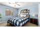 Cozy bedroom with a double bed, nightstands, and a ceiling fan at 1762 S Saddle St, Gilbert, AZ 85233