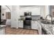 Kitchen boasts granite countertops and white cabinets at 1762 S Saddle St, Gilbert, AZ 85233