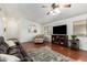 Living room with hardwood floors, comfy seating and a TV at 1762 S Saddle St, Gilbert, AZ 85233