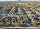 Aerial view of house and neighborhood with distant mountains at 17673 W Agave Rd, Goodyear, AZ 85338