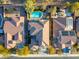 Aerial view of homes with solar panels and a pool at 17673 W Agave Rd, Goodyear, AZ 85338
