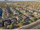 Aerial view of house, neighborhood, and distant mountains at 17673 W Agave Rd, Goodyear, AZ 85338