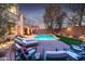 Spacious backyard with a refreshing pool and comfortable seating at 17673 W Agave Rd, Goodyear, AZ 85338