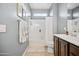 Bright bathroom with tub/shower, toilet and vanity at 17673 W Agave Rd, Goodyear, AZ 85338