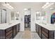 Double vanity bathroom with a large walk-in closet at 17673 W Agave Rd, Goodyear, AZ 85338