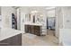 Double vanity bathroom with access to walk-in closet at 17673 W Agave Rd, Goodyear, AZ 85338