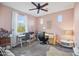 Home office with desk, chair, and ceiling fan at 17673 W Agave Rd, Goodyear, AZ 85338