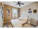 Cozy bedroom with ceiling fan, and neutral color scheme at 17673 W Agave Rd, Goodyear, AZ 85338