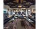 Spacious community room with high ceilings and comfortable seating at 17673 W Agave Rd, Goodyear, AZ 85338