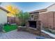 Stone fireplace in a backyard patio setting at 17673 W Agave Rd, Goodyear, AZ 85338