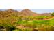 Golf course with players on green at 17673 W Agave Rd, Goodyear, AZ 85338