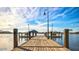 Wooden dock on lake with mountain view at 17673 W Agave Rd, Goodyear, AZ 85338