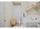 Laundry room with washer, dryer, and shelving at 17673 W Agave Rd, Goodyear, AZ 85338