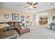 Open living room with a view of the kitchen and dining area at 17673 W Agave Rd, Goodyear, AZ 85338