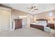 Main bedroom with king bed, ceiling fan, and ample closet space at 17673 W Agave Rd, Goodyear, AZ 85338