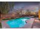 Relaxing pool and patio area with outdoor lighting, perfect for summer nights at 17673 W Agave Rd, Goodyear, AZ 85338