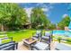 Inviting backyard with fire pit, pool, and ample green space at 17918 N 95Th St, Scottsdale, AZ 85255