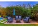 Relaxing backyard patio with fire pit and seating area, perfect for outdoor entertaining at 17918 N 95Th St, Scottsdale, AZ 85255
