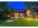 Spacious backyard with a view of the house and lush landscaping at 17918 N 95Th St, Scottsdale, AZ 85255