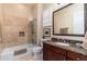 Clean bathroom with a tub and shower, marble vanity at 17918 N 95Th St, Scottsdale, AZ 85255