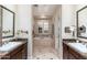 Double vanity bathroom with a large soaking tub at 17918 N 95Th St, Scottsdale, AZ 85255