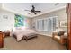 Spacious bedroom with a king-size bed and large windows at 17918 N 95Th St, Scottsdale, AZ 85255