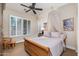 Charming bedroom with wooden sleigh bed and window shutters at 17918 N 95Th St, Scottsdale, AZ 85255