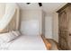 Spacious bedroom with a canopy bed and built-in wardrobe at 17918 N 95Th St, Scottsdale, AZ 85255