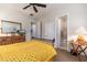 Comfortable bedroom with yellow bedding and ensuite bathroom at 17918 N 95Th St, Scottsdale, AZ 85255