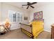 Bright bedroom with yellow bedding and a metal frame bed at 17918 N 95Th St, Scottsdale, AZ 85255